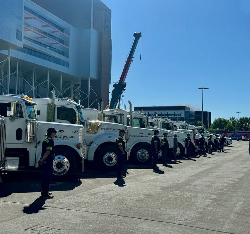 B and W Wrecker Service Boise Idaho Location Trucks and tow truck operators in a row