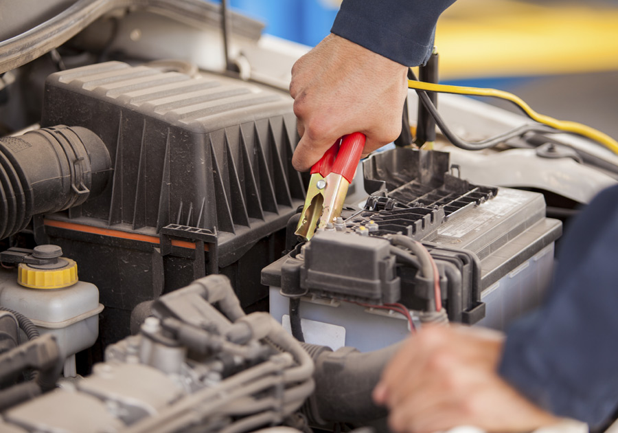 Roadside-Assistance-Boise-Idaho-B-&-W-Wrecker-Service-Man-Jumpstarting-Battery Roadside Assistance Boise Idaho Jump starting Battery in car B & W Battery